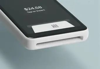 Close-up of a contactless card tapping a Square Handheld